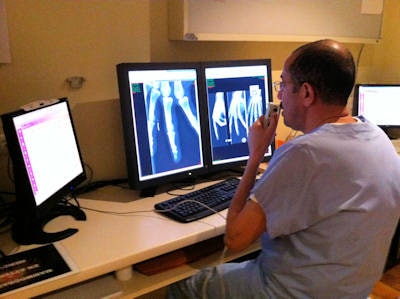 Dr. Abdel Tijari uses the RIS (left screen) and PACS (right screen) at the Clinic Montreal, Carcassonne in France. Images courtesy of Dr. Jean-Philippe Masson.