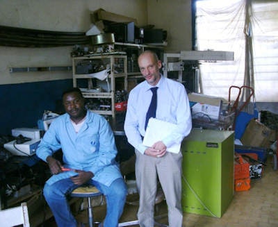 Dr. Klaus Schönenberger and a repair technician from a large hospital in Cameroon discuss how the inability to procure a simple, cheap spare part prevents them from repairing medical equipment. All images courtesy of Dr. Schönenberger.