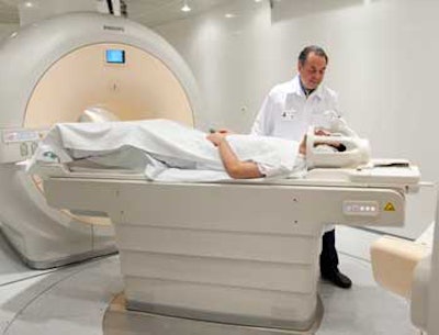 Dr. Osman Ratib, PhD, professor and chair of radiology at University Hospital of Geneva, prepares a patient for a PET/MRI examination.