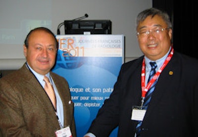 Dr. Jian-Ping Dai (right) meets with Dr. Guy Frija, head of the imaging department at Hôpital Européen Georges Pompidou in Paris and former secretary general of the SFR. Photo courtesy of John Brosky.