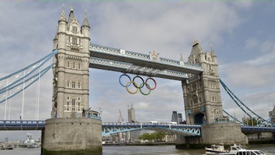 London is all set for the start of the Olympics on 27 July. Giant rings weighing more than 3,000 kg and measuring more than 25 meters wide by 11.5 meters tall, hang from Tower Bridge. During the games, each of London's famous bridges will be lit up in the evenings. Image courtesy of London 2012.