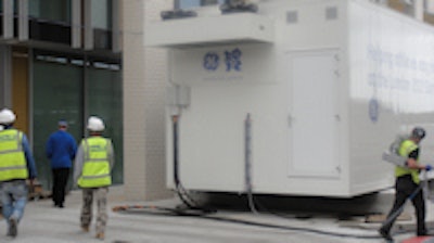 The Discovery MR750w wide-bore 3-tesla MRI system is located immediately opposite the main entrance to the polyclinic in a temporary structure resting on huge concrete plinths.