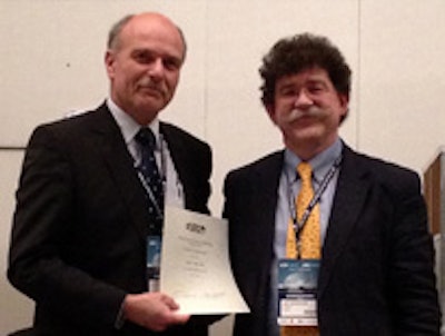 ISR President Dr. Jan Labuscagne (right) presents an award to Dr. András Palkó, past president of the European Society of Radiology, during ICR 2012 in São Paulo. All images courtesy of ISR.