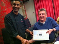 Rothwell is congratulated by executive chef Muhammed Karim.