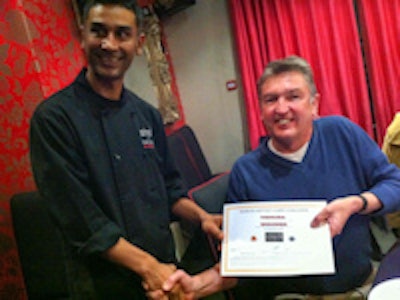 Rothwell is congratulated by executive chef Muhammed Karim.