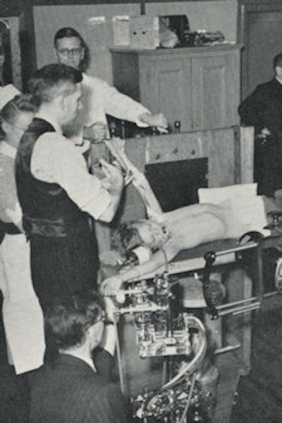 Left: Rotating drum serial changer, designed by Harry Coombs in 1948 in Sheffield. Cassettes are mounted on the drum, which can be rotated rapidly by hand between exposures. Right: Patient in front of rotating cassette drum for angiocardiography.