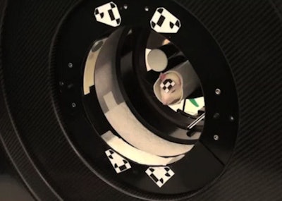 The tube-bound rat is confined within a tube but is free to move its head