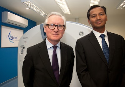 His honor Judge Peter Thornton QC, chief coroner for England and Wales, and Matt Chandran, founder and CEO of iGene, with a GE Healthcare Optima CT540 scanner at the opening of the U.K.’s first digital autopsy facility in Sheffield.