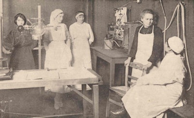 Marie Curie with her daughter, Irène, and other researchers in her laboratory at the Edith Cavell Hospital in 1914.