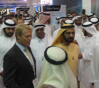 Sheikh Mohammed bin Rashid Al Maktoum is escorted on the floor of Arab Health 2015 by Kay Zwingenberger, CEO of Siemens Healthcare, Middle East.
