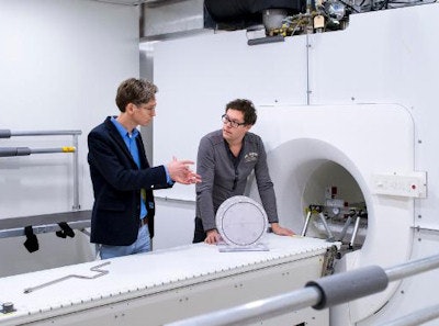 Bas Raaymakers (left), professor of experimental clinical physics at UMC Utrecht, in front of Elekta's Atlantic system with Robert Spaninks, Elekta service engineer. Image credit: PRNewsFoto/Elekta