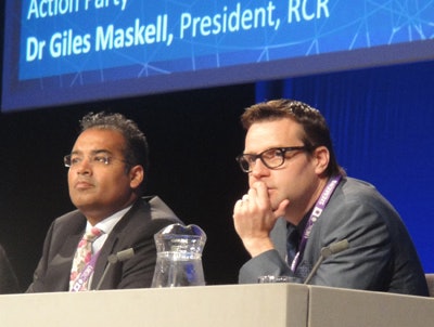 Outsourcing destabilizes and fragments, said Dr. Clive Peedell (right), shown here with broadcaster Krishnan Guru Murthy, who led the UKRC debate.