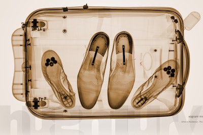 Shoes inside the suitcase of 'Mr. and Mrs. Smith.'