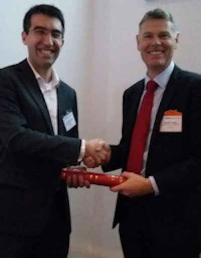Author Jean Provost receives the Roberts Prize from IPEM President David Brettle.