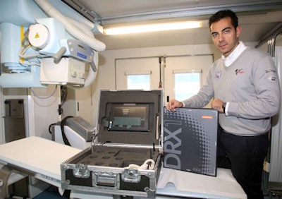 Dr. Michele Zasa of Clinica Mobile with a Carestream DRX-1 cassette. Image courtesy of Carestream.