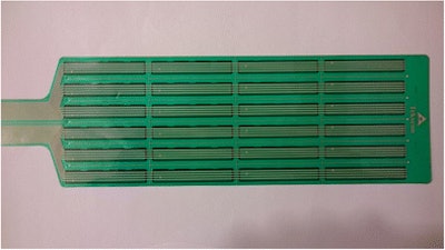 A Tekscan Iscan 9801 pressure sensor employed in the study. Each strip consists of four sensor elements. The electrical impedance of the sensor elements decreases when subject to pressure.