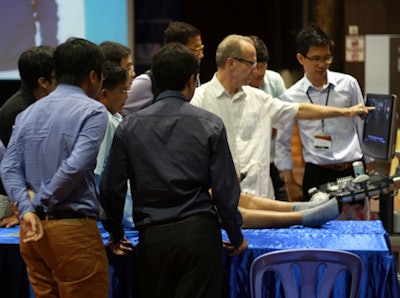 RAB volunteer Dr. David Mitchell doing hands-on ultrasound training in Cambodia in 2016.