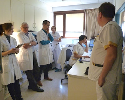 As of 6 February 2018, all radiology departments must undergo clinical audits. In this CT room, radiographers, nurses, and technicians undergo audit training in Belgium. Shown on the left are Evguenia Boldyreva, radiology technologist and head of training at Qaelum, Dr. Jan Schillebeeckx, and Tom Vanherpe, PhD, a researcher atQaelum. All images courtesy of Dr. Jan Schillebeeckx.