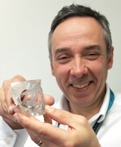 Without accurate data from CT, it would be impossible to create CAD models for 3D-printed inserts, said Peter Llewelyn Evans, shown here holding a 3D printed implant for an eye socket.