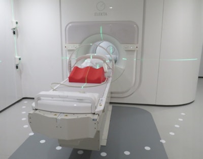 The MRI-linac at the University Medical Center Utrecht, showing the lasers for patient set-up, the patient positioning devices and the radiofrequency receive coil.