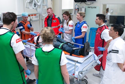 Members of the multidisciplinary trauma team assess a patient. Image courtesy of Dr. Joost Peters. Copyright: Frank Muller/Zorg in Beeld.