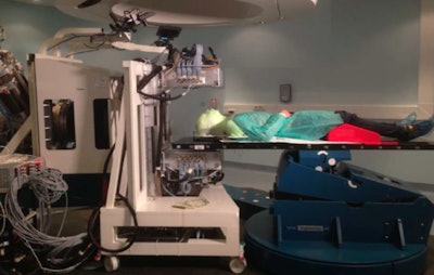 The INSIDE system positioned for measurement, with detector panels positioned above and below the patient. (Courtesy: E Fiorina et al, Physica Medica, 10.1016/j.ejmp.2018.05.002, © 2018, Associazione Italiana di Fisica Medica)
