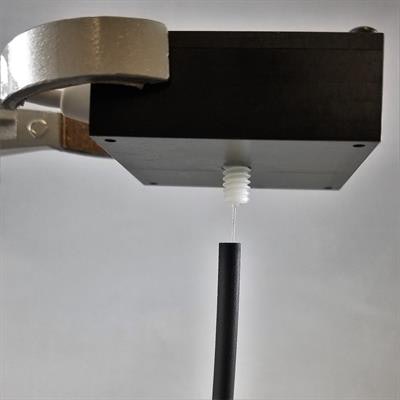 Prototype sensor with scintillating fiber inserted partially into an artificial vein. Image courtesy of Josh Knowland.