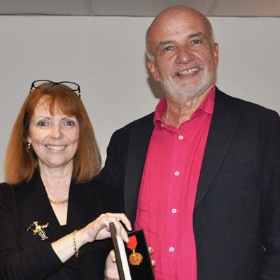 Dr. Jane Phillips-Hughes, BIR president, presents Gunter Dombrowe with the Distinguished Service Medal. Image courtesy of the BIR.