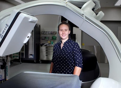 First author Tess Reynolds with the conebeam CT scanner. Image courtesy of Tess Reynolds.