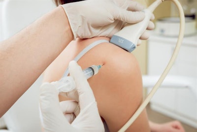 Person receiving injection in the shoulder while being scanned with ultrasound