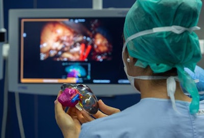 Clinician examines a 3D-printed kidney model for cancer surgery. Image courtesy of Stratasys.