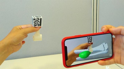 Visualization of a patient's distal leg sarcoma as a 3D model on a smartphone. Image courtesy of Pascau et al.
