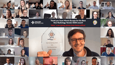 The Smart Reporting team shows its joy over winning the Best New Radiology Vendor award. The trophy is held by Prof. Dr. Wieland Sommer.