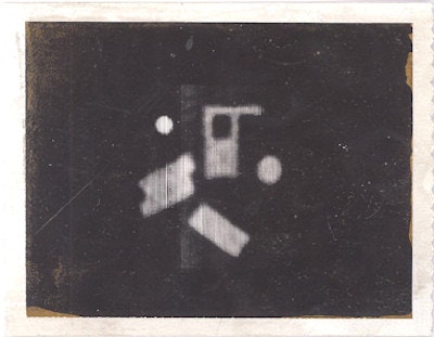 Polaroid image of the first CT scan made by Godfrey Hounsfield of a Perspex phantom.