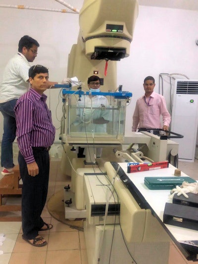 Tirthraj Adhikari (far right) and colleagues commission a cobalt-60 radiotherapy system during the pandemic. Courtesy of Tirthraj Adhikari.