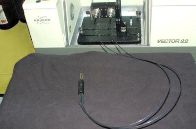 The sensor system is based on a spectrometer and a mid-IR transmitting fiber. When the exposed central part of the fiber (the U-shape) touches a skin lesion, the system measures its characteristic mid-IR absorption spectrum. Image courtesy of Abraham Katzir, Applied Physics Group, and Tel Aviv University.