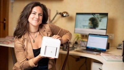Judit Giró Benet holding the Blue Box. Image courtesy of Dyson.