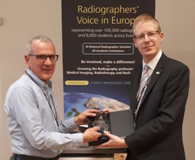 Paul Bezzina, PhD, (left) receives an award at a previous ECR from Jonathan McNulty, PhD, immediate past president of the European Federation of Radiographer Societies.