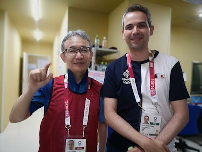Emeritus Prof. Kunihiko Fukuda, former chair of radiology at The Jikei University School of Medicine, is working at the Olympic Village as a volunteer radiologist in charge of MRI reporting. He is shown here with radiologist Dr. Michel Crema, who is working with the French National Team at the Games. Image courtesy of Emeritus Prof. Kunihiko Fukuda.