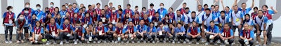 Medical staff and volunteers gathered in front of the polyclinic before the closing ceremony took place on 8 August