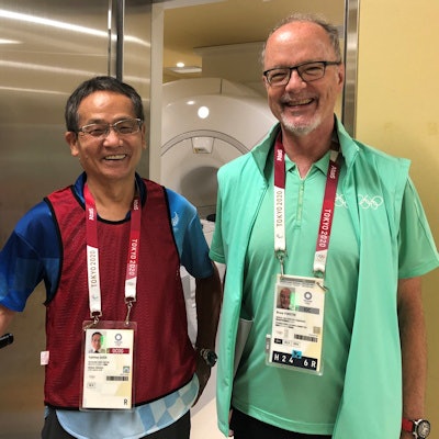 Dr. Yukihisa Saida and Dr. Bruce Forster, professor and head of radiology at the University of British Columbia and president of the Canadian Radiologic Foundation. Forster was a regular visitor to the polyclinic during the Tokyo Games and gave advice to Saida and his colleagues. He also helped raise morale and energy levels by bringing sweets and other goodies! Image courtesy of Dr. Yukihisa Saida.