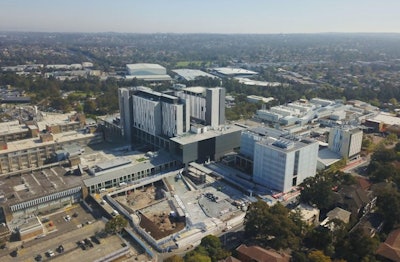 This aerial photo of the Westmead shows the new central acute services building, which includes two new emergency departments and 300 patient rooms and is part of a 1-billion Australian dollar transformation of the Westmead Health Precinct in Western Sydney. Photo courtesy of Xinhua/Alamy Stock Photo