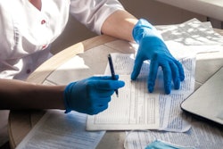 2021 11 03 16 15 8936 Doctor Fills Patient Medical Record 400