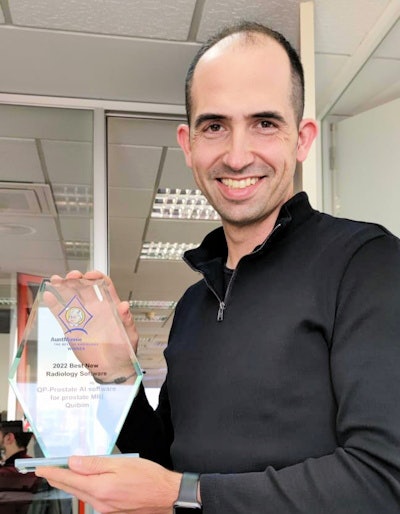 Angel Alberich-Bayarri, PhD, receives the trophy at Quibim's offices in Valencia, Spain.