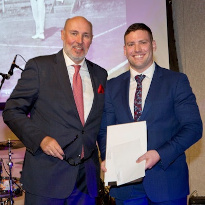 Parizel hands over an award to Dr. Kyle Raubenheimer, a junior medical officer at RPH, in recognition of his excellent communication skills in requesting and motivating radiological examinations.