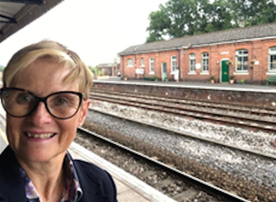 Dr. Kath Halliday says she doesn't mind train rides, but she's a bit tired of staying in mediocre hotels.