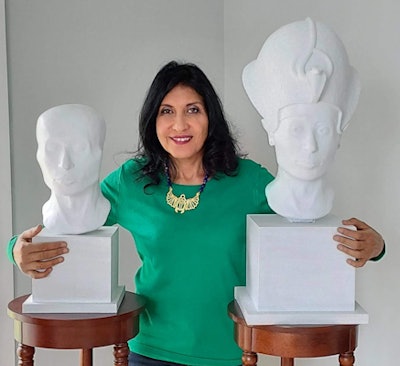 Dr. Sahar Saleem with busts of King Tutankhamun. The artistic facial bust on the right was sculpted onto the 3D-printed CT skull of his mummy, revealing how Tut would have looked when alive.