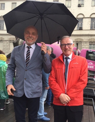 On a 2019 trip to Tbilisi in Georgia, Brady is kept dry by Prof. András Palkó from Szeged, Hungary, ESR President in 2011-2012.