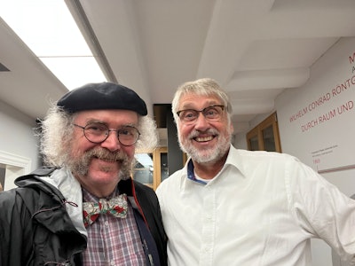 Dr. Adrian Thomas (left) and Uwe Busch, PhD, share a deep passion for radiology's history. Images courtesy of Dr. Adrian Thomas.