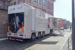 United Imaging's mobile digital PET/CT unit stands parked outside a hospital in Piacenza, Italy.